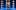 ETC Cinderella AEA 8 A feminine-looking person with red hair and a gold dress holds up a man with blue hair and facial hair as he kicks up his right leg. Behind them are four blue and white checkerboard pillars.