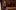 his eye is on the sparrow 3 A Black woman with black hair sits in a purple velvet coat and looks to the upper right corner. A white man sits behind her at a piano.